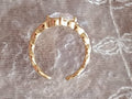 Bague Dorée Effet Tressé avec Cabochon en Verre – Réglable